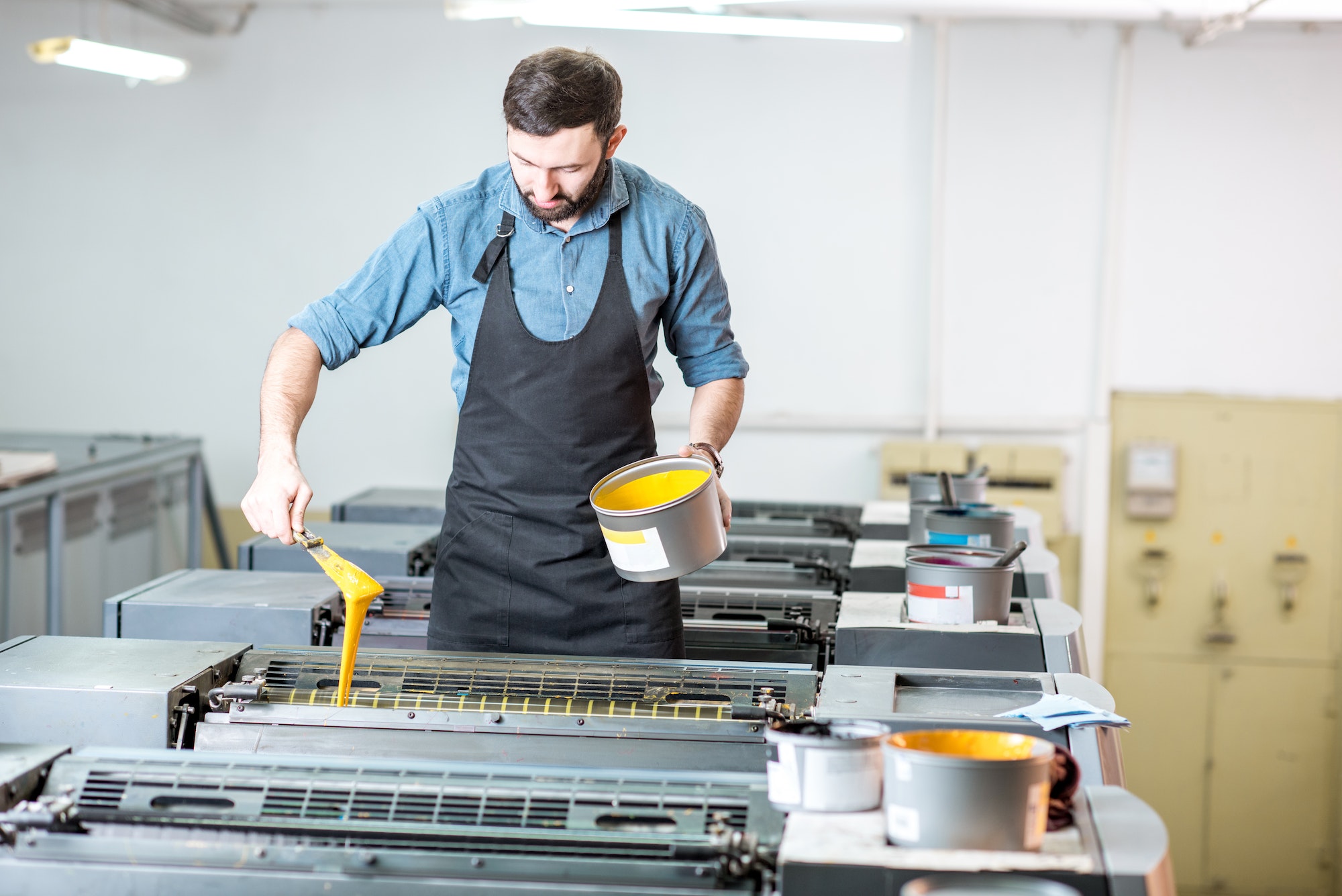 Typographer with paint at the manufacturing